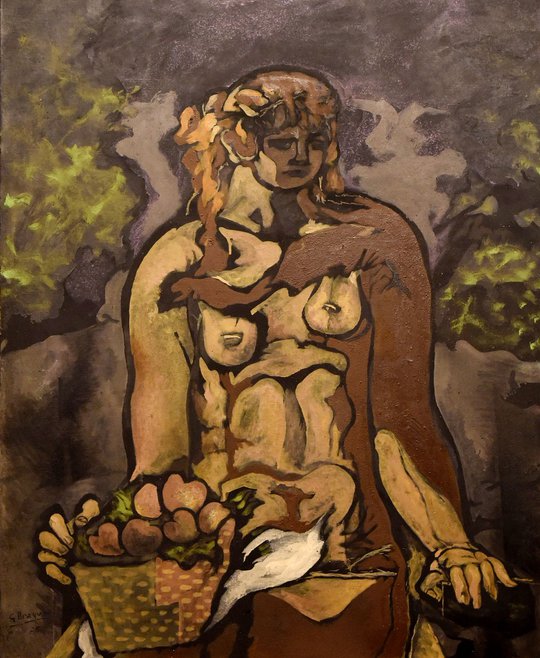 Desnudo sentado con canasta de manzanas